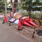 Futuristic Red Airplane-Shaped House Surrounded by Trees