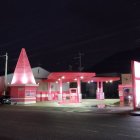 Colorful melting ice cream structure under night sky with stars and bubbles