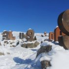 Unique Curved Modern Wooden Cabins in Snowy Landscape