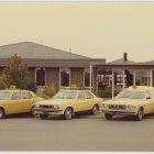 Vintage Photo: Car Dealership with Yellow Corvettes & Car Tower Display