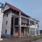 Asian-style architectural building with multi-tiered roofs and ornate facade details