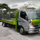 Green and Black Customized Tow Truck with Flatbed and Wheel Lift, Outdoors