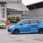 Digital painting of abandoned blue car and yellow van in post-apocalyptic scene