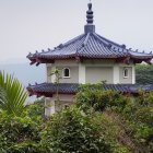 Round White House with Conical Roof and Greenery Balconies