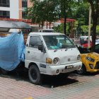 Colorful Custom Decorated Sports Cars in Parking Lot with Vibrant Artwork