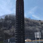 Urban graffiti-covered cylindrical structure in rundown area