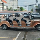 Vintage Car Servicing Scene with Tools and Classic Car Background