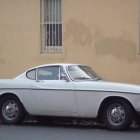 Vintage Light Blue Two-Door Coupe with Long Hood and Wire Wheels