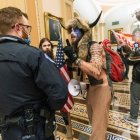 Elaborate animal-themed costumes at a convention featuring birds and a fox.