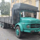 Vintage Blue Mercedes Truck with Patina on Paving Stone Street