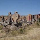 Modern wooden cabins in desert landscape under clear sky