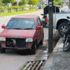 Vintage red and white cars with bicycle in nature scene