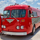 Abandoned vintage red bus in desert landscape