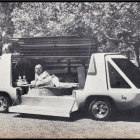 Futuristic autonomous vehicle with stylish passenger and blossoming trees