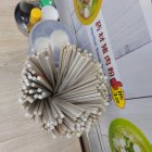 Detailed View of Dandelion Seed Head on Blue Background