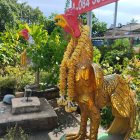 Colorful fantastical bird with elaborate feathers in mountain backdrop