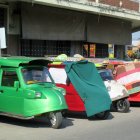 Futuristic colorful vehicles with bubble cabins and dotted patterns.