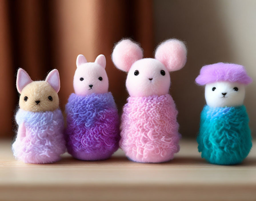 Colorful Plush Finger Puppet Animals on Wooden Surface
