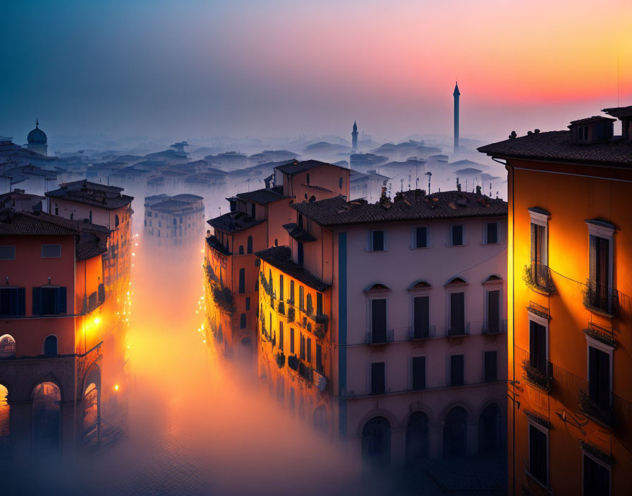 Foggy dawn over old European town with warm street lights and vibrant sunrise