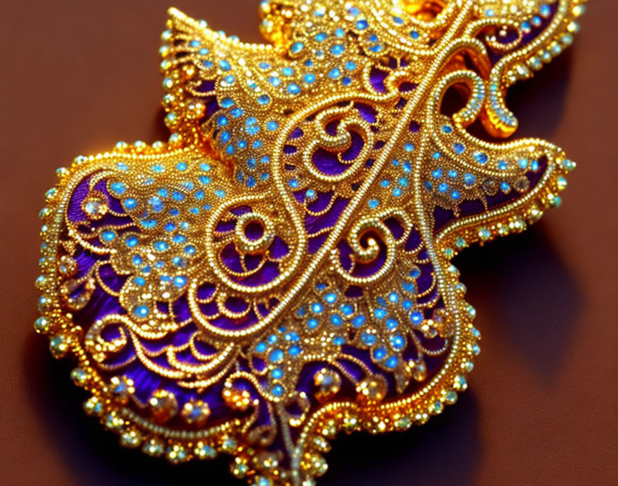 Golden Filigree Brooch with Blue Bead Pattern on Silky Brown Background