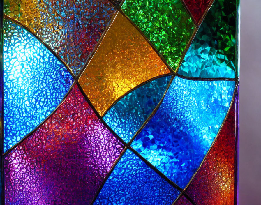 Colorful Stained Glass Window with Interconnected Panels in Various Hues