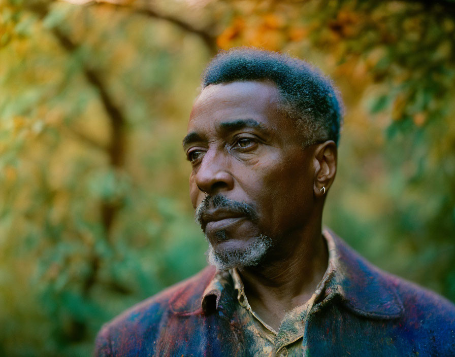 Mature Man with Gray-Flecked Facial Hair in Autumn Setting