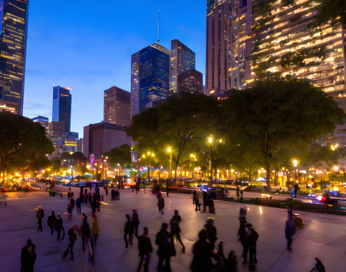 City Square Dusk Scene with Illuminated Buildings and Blurred Figures