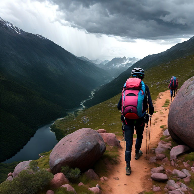 Hikers with backpacks trek on mountain path overlooking valley with river and approaching rain.