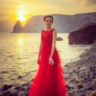 Woman in Red Gown Amidst Blooming Water Lilies