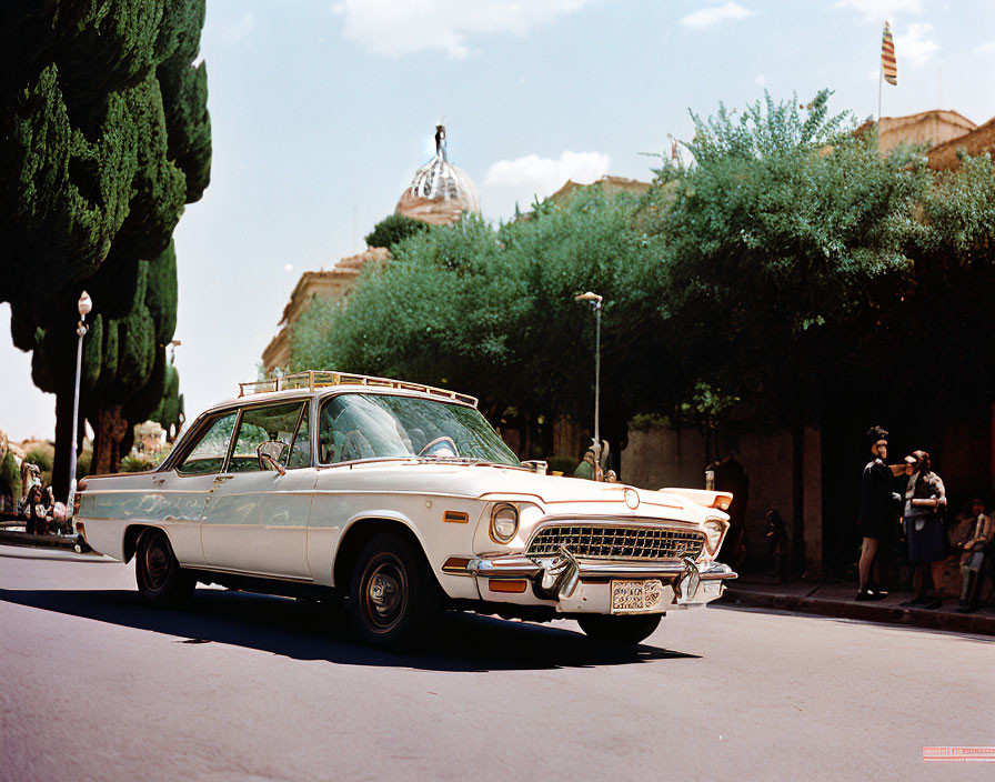 Vintage Car on Sunny Street with Pedestrians and Domed Building