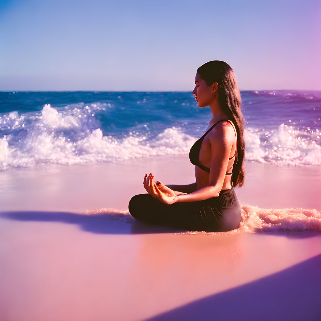 Woman Meditating on Beach with Waves and Purple Sky