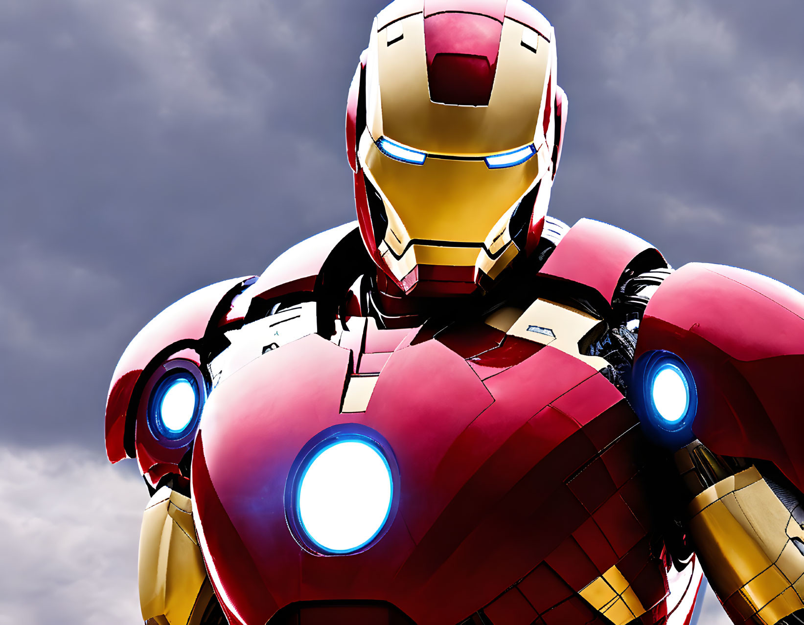 Iron Man suit detail: glowing eyes and chest reactor on cloudy sky.