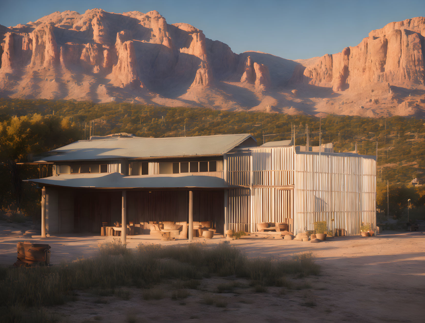 Sunrise view of modern building with large windows against cliffs and clear sky