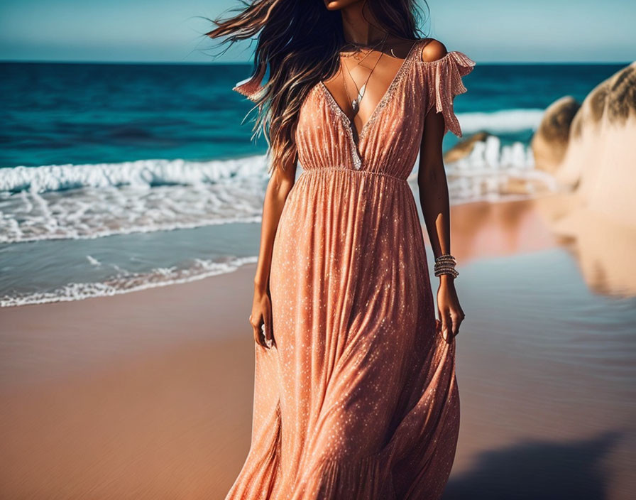 Person in Pink Dress Walking on Sunlit Beach with Waves