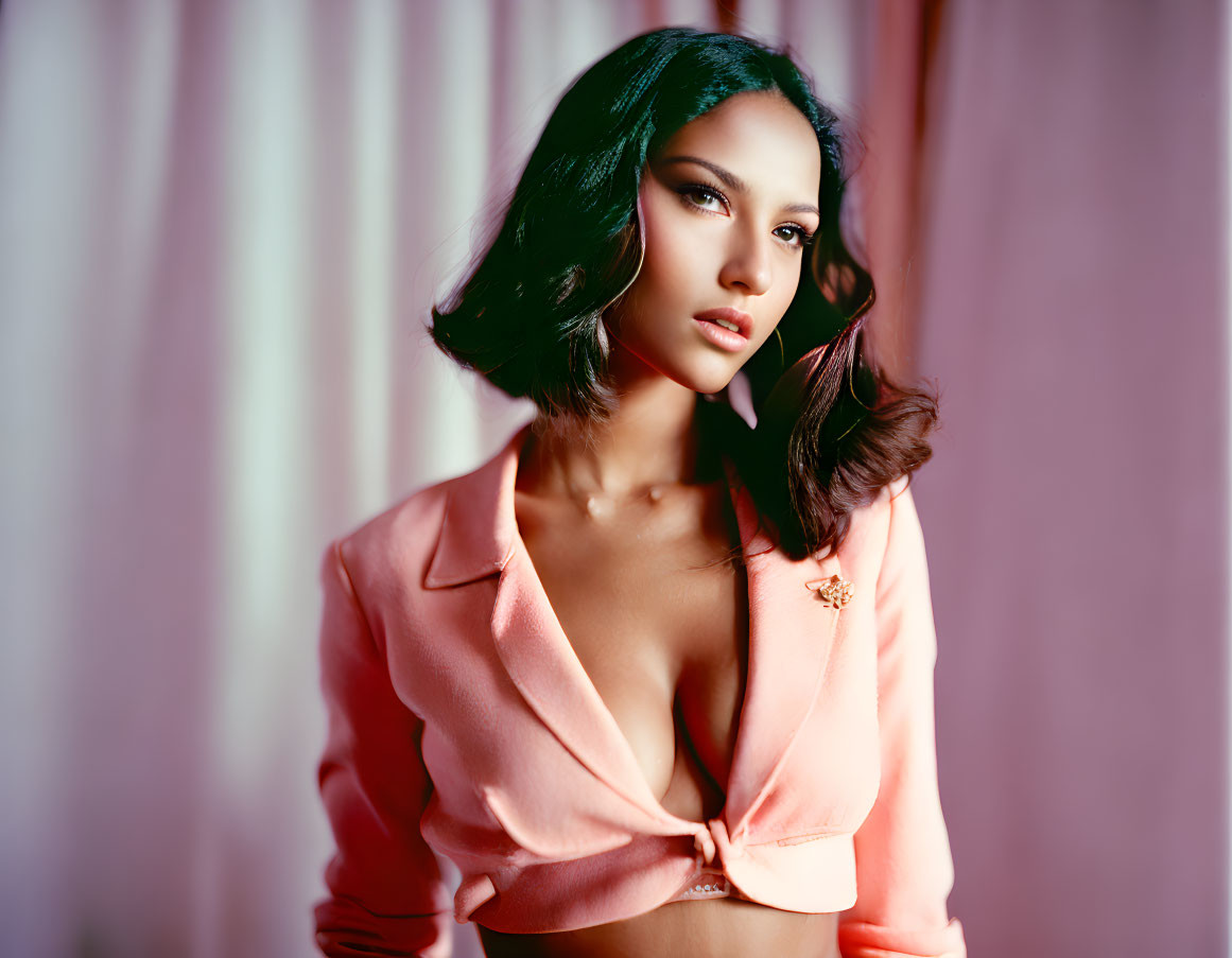 Dark-Haired Woman in Peach Blazer Poses with Confidence