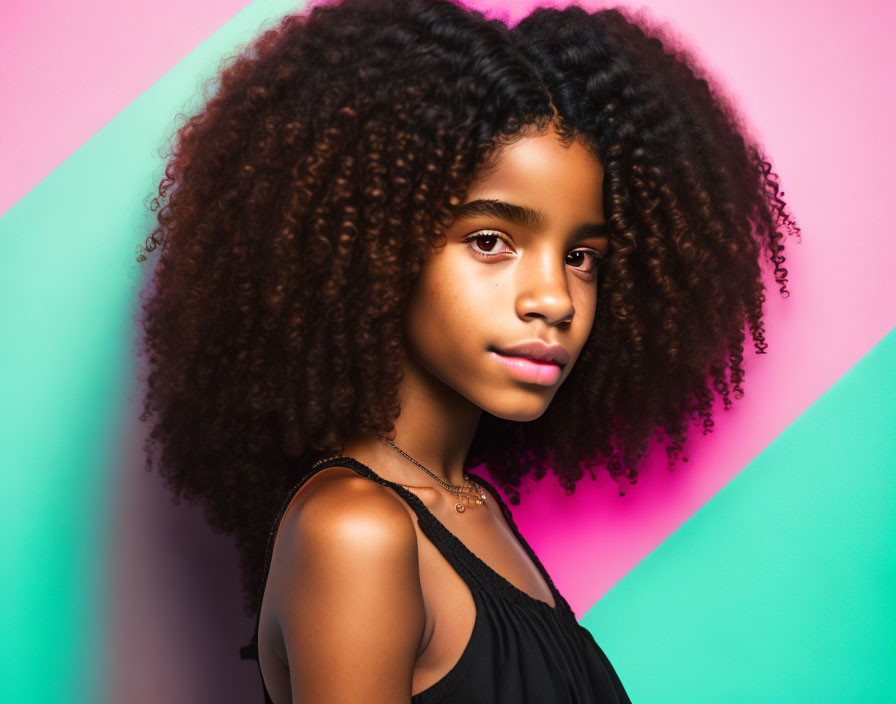 Curly-Haired Youth on Pink and Teal Background