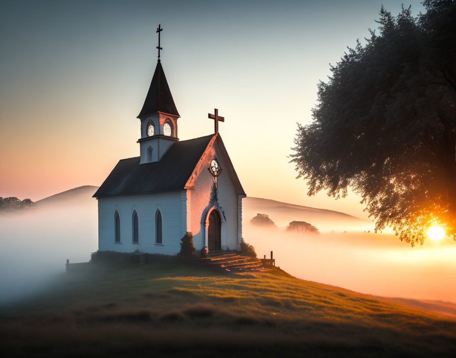 White church with steeple in misty sunrise scene