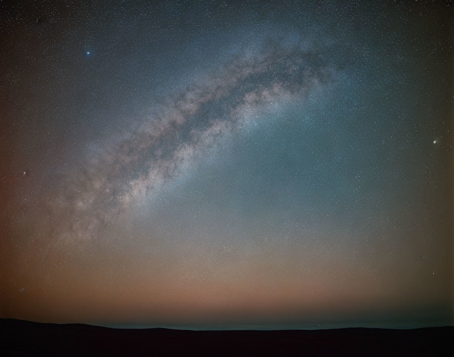 Panoramic Milky Way Galaxy Over Dark Horizon