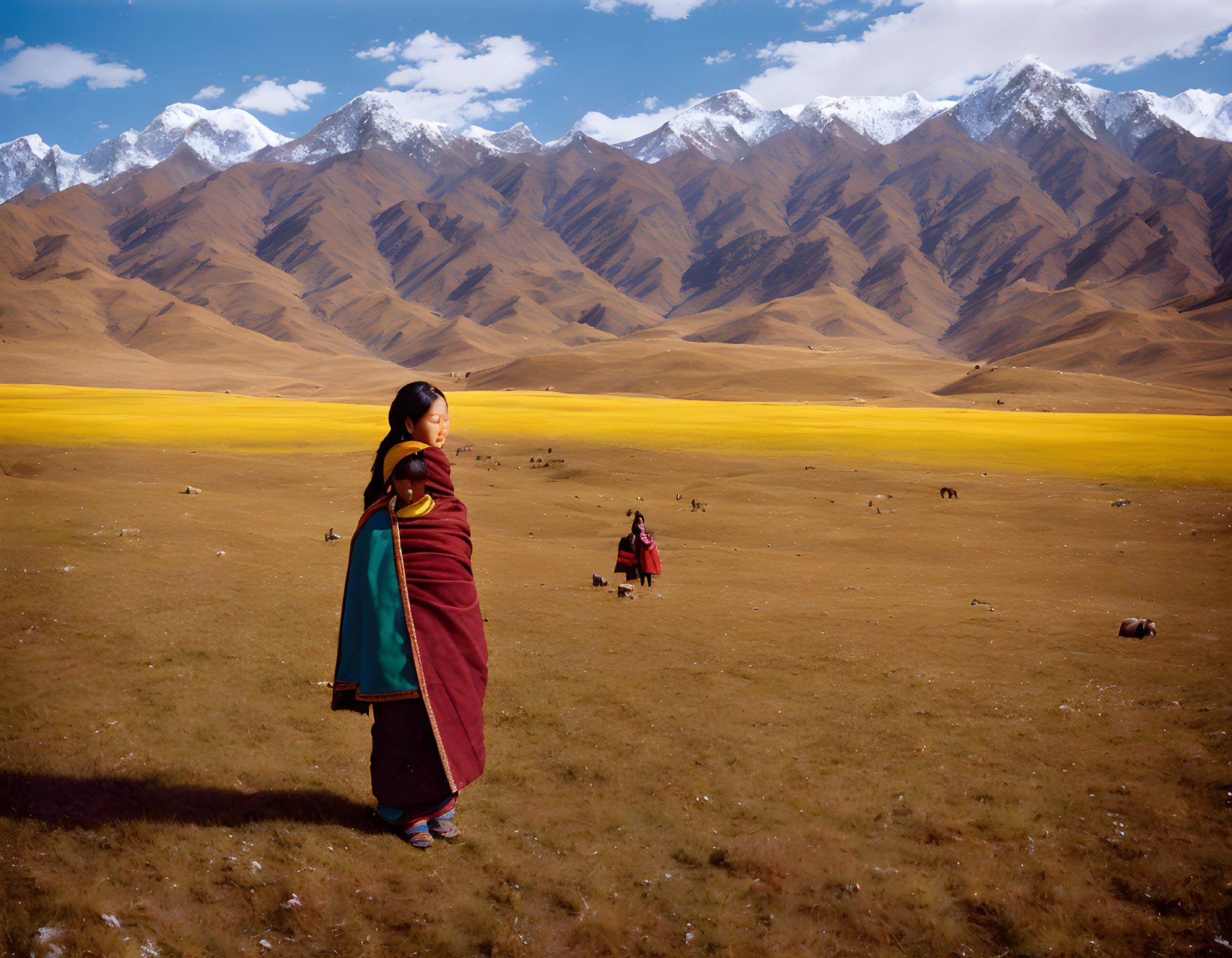 Traditional Attire Woman in Golden Valley with Mountains