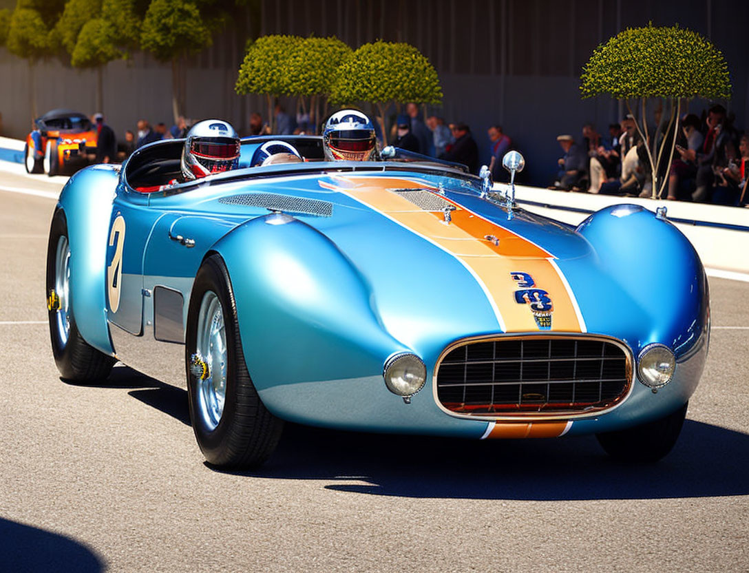 Classic Blue and Orange Racing Car with Number 2 and Two Drivers on Sunny Day