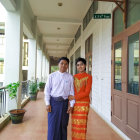 Formal Attired Couple on Balcony with Heart-shaped Lights