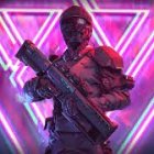 Futuristic person with submachine gun in neon-lit background