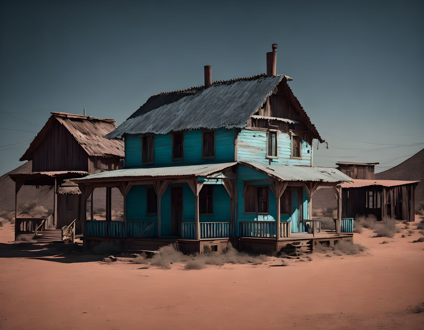 Weathered Blue Two-Story House in Desert Setting