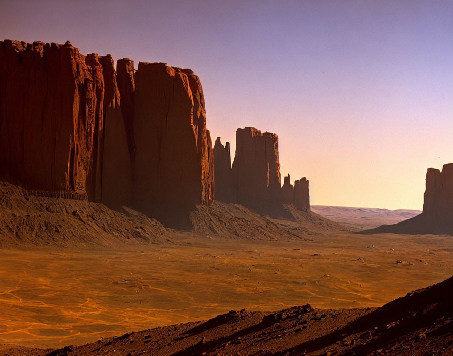 Majestic red rock formations in desert at sunrise or sunset