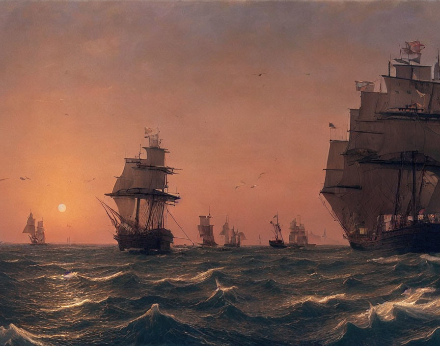 Sail ships on wavy sea at sunset with birds in warm, hazy atmosphere