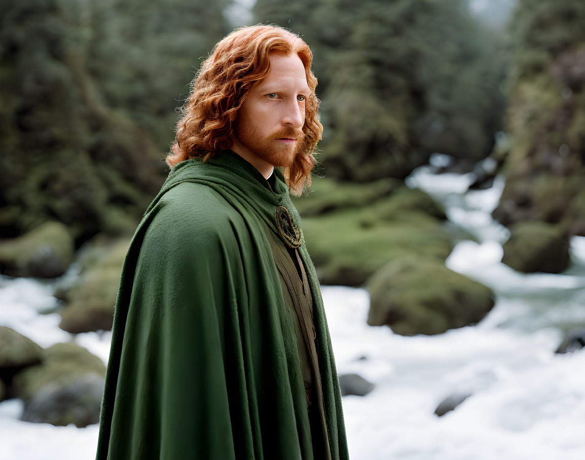 Long red-haired person in green cloak by forest stream