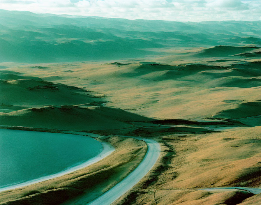 Grasslands and River with Dramatic Sky and Cloud Shadows