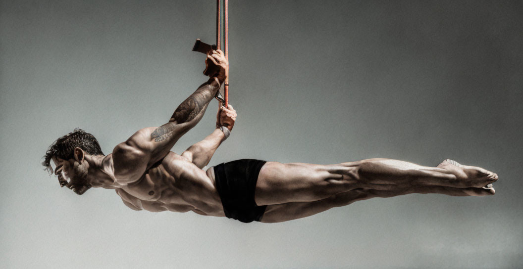 Muscular person demonstrates horizontal flagpole exercise