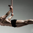 Muscular person demonstrates horizontal flagpole exercise