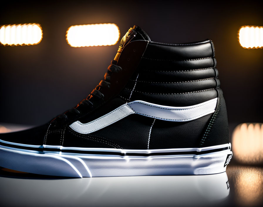 Black High-Top Sneaker with White Accents on Dark Background